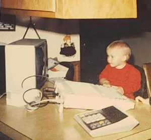Mike using a computer when little